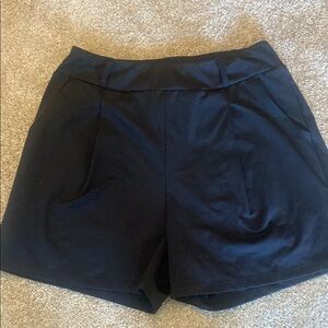 Black Pleated Stretch Shorts with pockets and belt loops